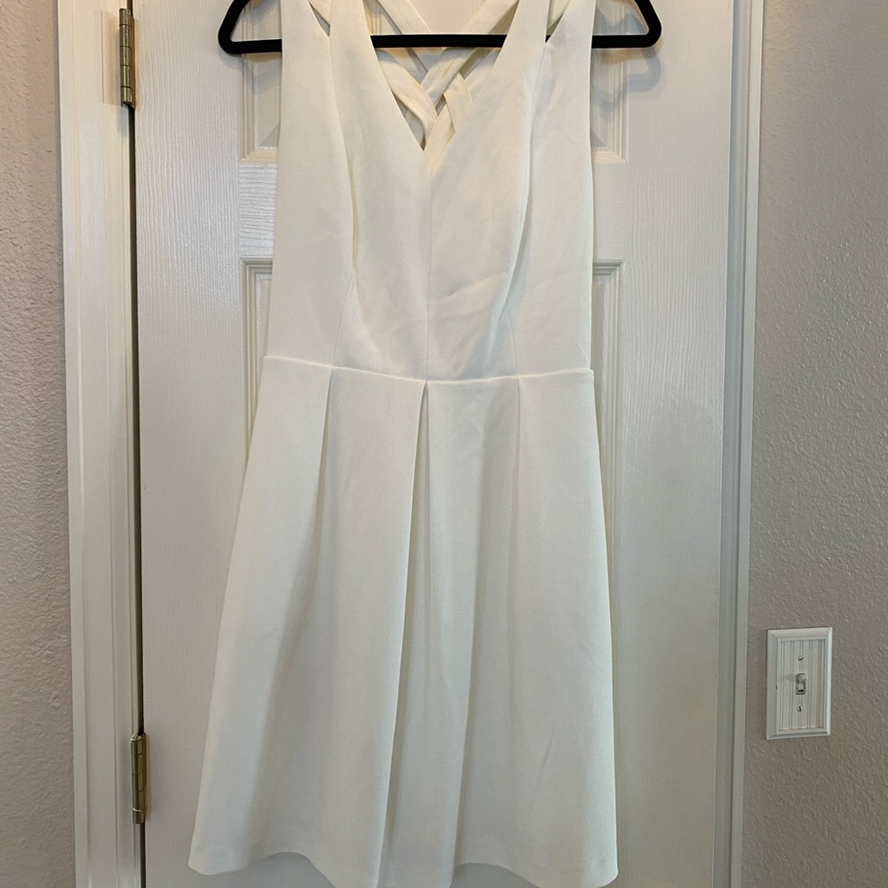 White dress with crossing straps, size 8